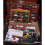 Two glazed wall hung display cases containing assorted Matchbox die-cast vehicles