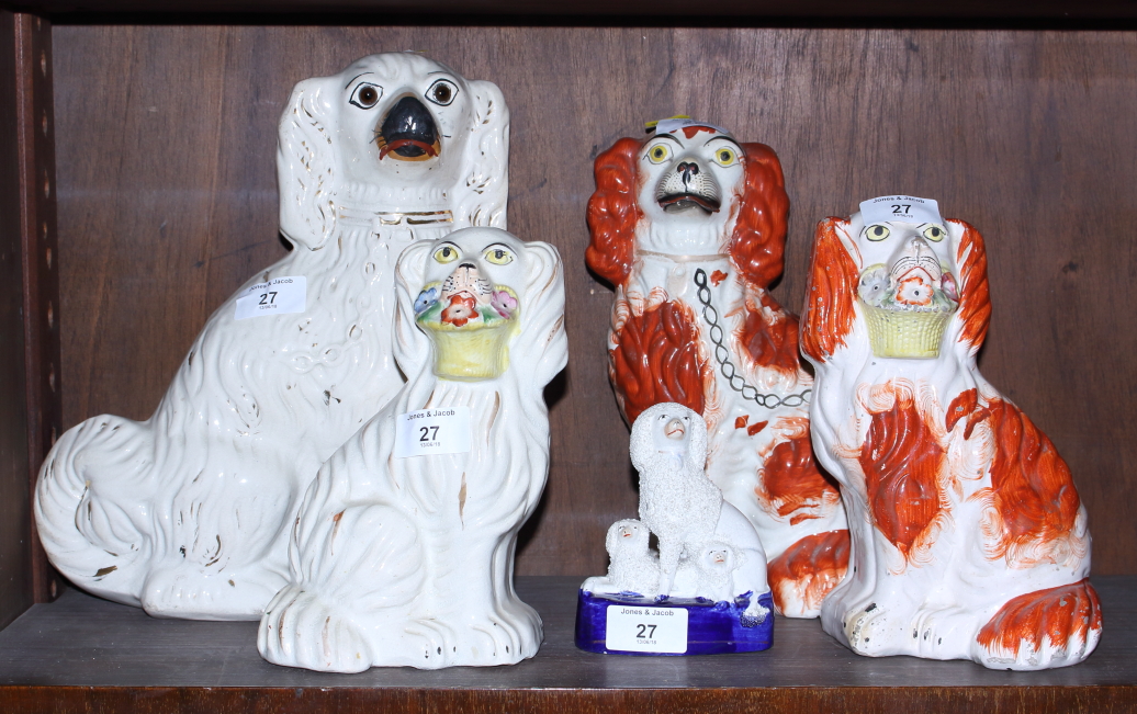 Five Staffordshire pottery dogs