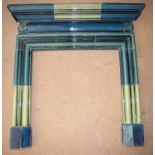 A Doulton Lambeth fireplace surround with mantel shelf, decorated in a blue / green glaze