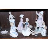 Seven Spanish porcelain figures, various, including Lladro and Nao (damages)