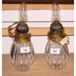 A pair of Victorian silver topped scent bottles (now converted to electric lamps), 8" high