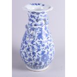 A 20th century Chinese blue and white porcelain baluster vase, decorated scrolling foliate and