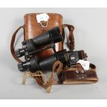 A pair of binoculars, in fitted leather case, together with a camera