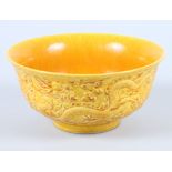 A Chinese yellow porcelain "dragon" bowl, with five claw flying dragon and flaming pearl decoration,