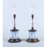 A pair of 19th century Wedgwood candlesticks with glass sconces and knops, on cylindrical bronze and