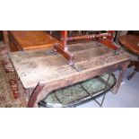 An 18th century oak kitchen table with three plank top incised shove ha'penny board and Crokinole,