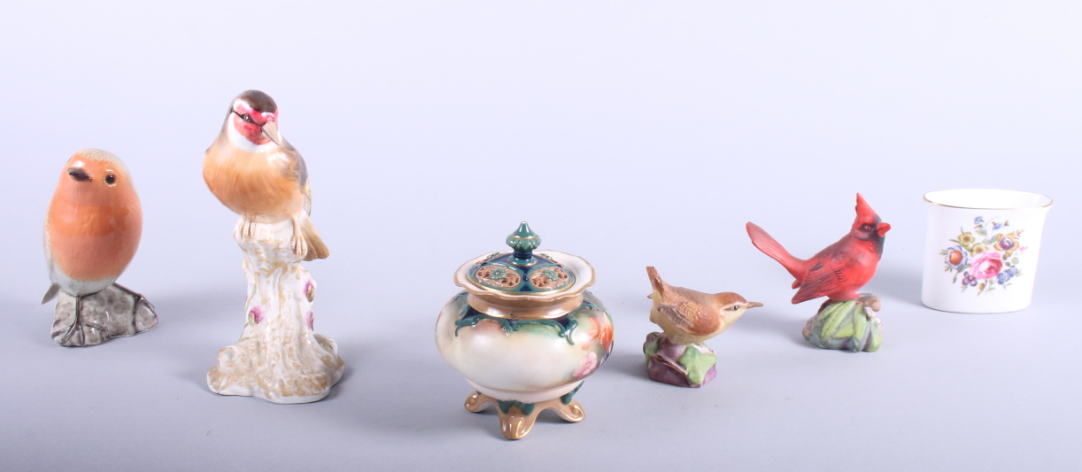 A Royal Worcester porcelain model of a goldfinch, two other Royal Worcester bird models and a Hadley