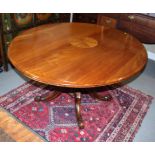 A 19th century walnut oval tilt top loo table, on carved column and quadruple splay supports, 48"