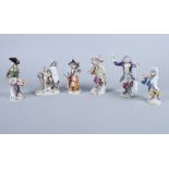 A 19th century Meissen porcelain five-piece monkey band, most with cross swords mark and one with