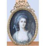 Two oval portrait miniatures of 18th century women, in gilt metal and ebonised wooden frames, and