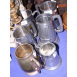Six assorted pewter tankards and an Arabian dagger