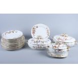 A Royal Worcester Aesthetic movement porcelain part dinner service, decorated with flowers and