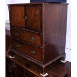 A 19th century oak and mahogany banded bedside cabinet, fitted cupboard and two lower drawers, 25"