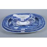 Two "Willow" pattern blue and white porcelain oval meat plates and a Spode "Italian" sauce boat