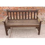 A slatted wooden garden bench by R A Lister, 52" long