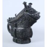 A Chinese pre 19th century Archaic design vessel, in the form of a dragon's head with serpent "C"