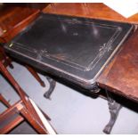 A late 19th century ebonised and gilt line inlaid fold-over top card table, on twin turned column