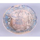 A 19th century conical bowl, painted with a figure on horseback and a border of Islamic script, on