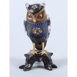 An early 20th century Japanese cloisonne standing owl, on carved hardwood stand, 4" high