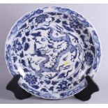 A Chinese Ming design blue and white porcelain scalloped edge charger, decorated with painted