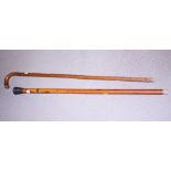 A sword stick, 36" overall, and a silver mounted Malacca cane, 35" long