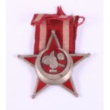 A Gallipoli star, complete with ribbon, 2 1/2" wide