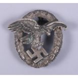 A white metal Luftwaffe Observer's cap badge