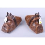 A pair of late 19th century / early 20th century South American clogs, carved with floral and