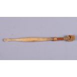 An 18th century turned bone ear scoop with natural sponge end, 4 3/4" long