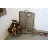 A copper coal helmet, a brass column table lamp, an Edwardian brass wirework fireguard and a set