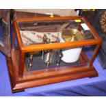 A Negretti and Zambra barograph, in mahogany glazed case, 14" wide