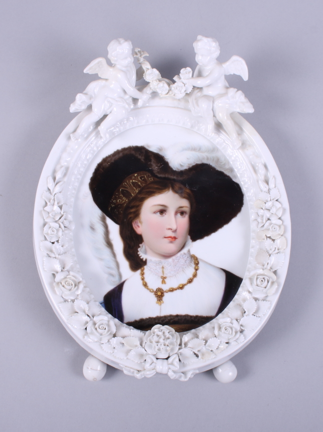 A 19th century German porcelain blanc de chine oval frame, bearing the mark for Helena Wolfsohn,