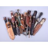 Fourteen sheath knives, various, and three Arabian daggers, with scabbards