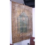 A Persian antique silk prayer rug, the mihrab in shades of blue and multi-bordered in red and