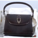 A vintage dark brown lizard skin and suede lined handbag, by Gucci