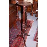 A 19th century mahogany torchere, with fluted column and tripod splay support, top 12" dia
