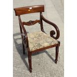 An early 19th century mahogany bar back scroll arm elbow chair, with drop-in seat, on faceted