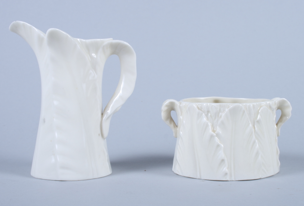 A Royal Worcester "leaf ware" porcelain milk jug and matching sugar bowl, 4" high