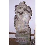 A weathered composite stone statue of embraced lovers, on plinth base, 46" high overall