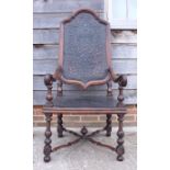 An 18th century rosewood elbow arm chair with scroll arms and Spanish embossed leather seat and back