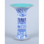 A Chinese Ming design blue and white porcelain gu vase, with lotus leaf and scroll decoration,