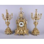 A French late 19th century gilded brass three-piece clock garniture by H Luppens, Paris, the white