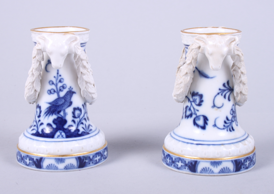 A pair of late 19th century Meissen porcelain spill vases with applied ram's head and garland