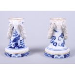 A pair of late 19th century Meissen porcelain spill vases with applied ram's head and garland