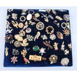 A quantity of costume jewellery brooches, each of a different designer