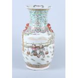 A Canton design porcelain vase, with figure and dragon decoration, dragon ring handles and six