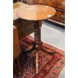 A 19th century circular top occasional table, on bobbin turned column and tripod splay support, 16