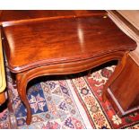 A 19th century mahogany fold-over top card table with concertina action, 33" wide