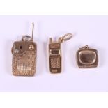 Three 9ct gold pendants, in the form of a telephone, a television and a radio, 8g