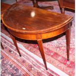 An early 19th century mahogany, satinwood, box and ebony line inlaid fold-over top card table, on